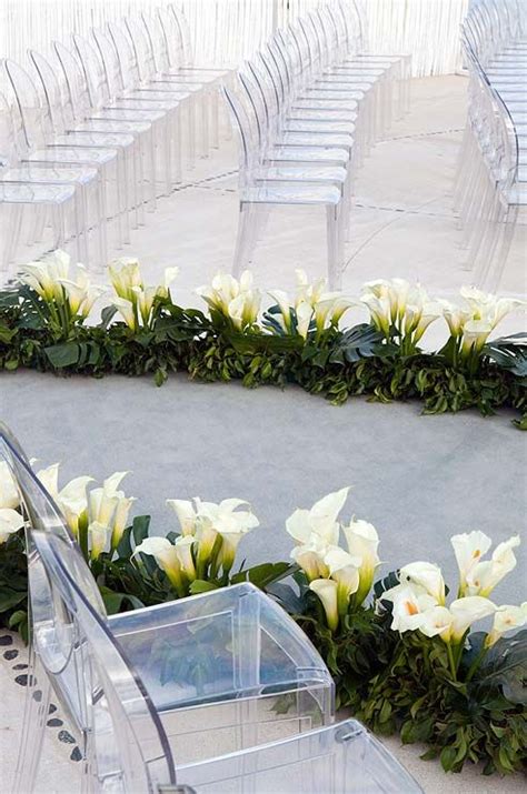 Clusters Of Calla Lilies Mark The Edges Of The Organically Shaped Aisle