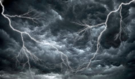 Dark Ominous Rain Clouds And Lightning Stock Photo