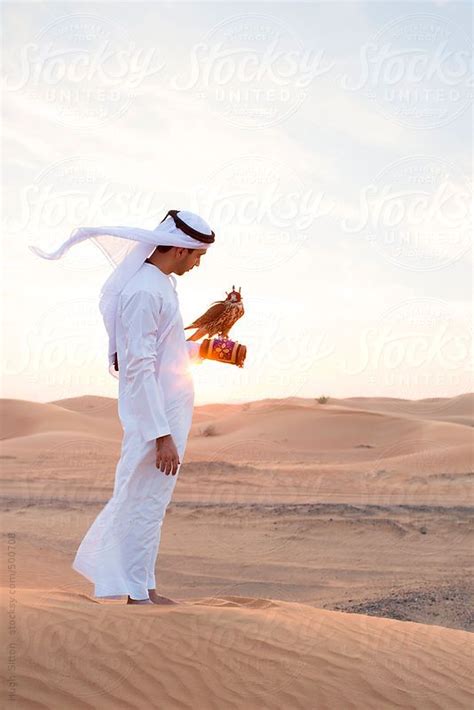 Arabian Man In Desert With Falcon Dubai United Arab Emirates By Stocksy Contributor Hugh