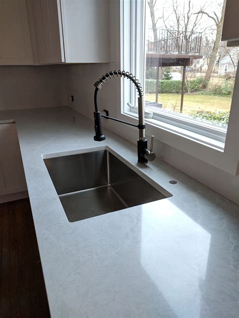 Now install the kitchen sink. Pental Quartz Ice Lake with Stainless Sink and Black Kraus ...