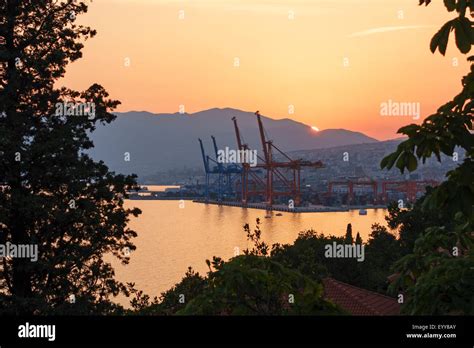 Rijeka Croatia Sunset Over The Port And The Dockyard Cranes With The