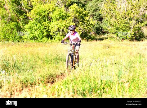 Pre Teen Girl Mountain Biking Stock Photo Alamy