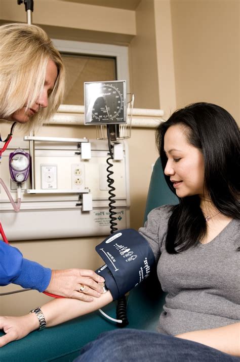 Free Picture Female Nurse Process Conducting Blood Pressure