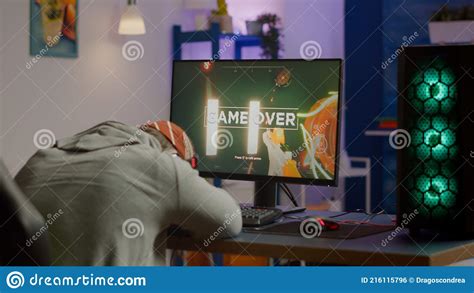 Game Over For Sad Gamer Playing Shooter Video Games On Powerful