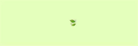 Two Green Leaves Floating In The Air On Top Of A Light Green Background