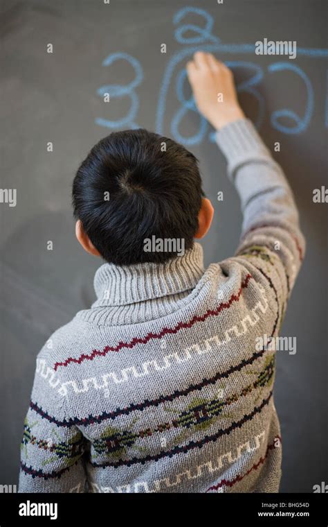 Children Writing On Blackboard Stock Photos And Children Writing On