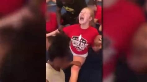 disturbing video shows high school cheerleaders screaming as they re forced to do splits the