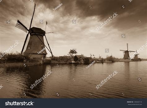 Dutch Windmill Reflection On Water River Stock Photo