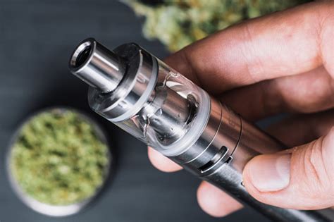 Using an e vape pen properly requires a little practice. Marijuana Bud Cannabis In Glass Jar With Oil Extract Vape ...