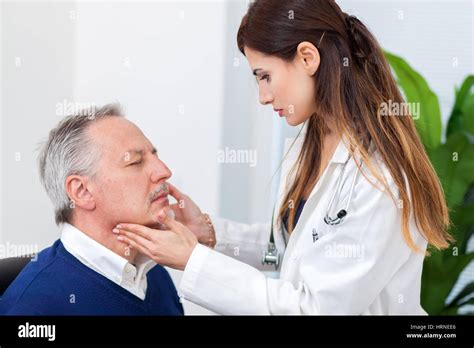 Doctor Checking The Lymph Nodes Size Of Her Patient Stock Photo Alamy