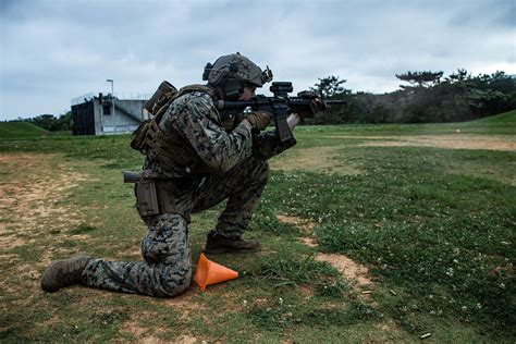 A Force Reconnaissance Marine Fires His M4a1 Service Rifle A Photo On