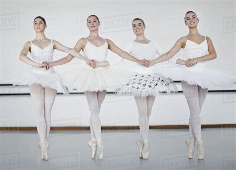 Ballet Dancers Holding Hands In Studio Stock Photo Dissolve