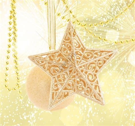 Hanging Gold Christmas Balls And Star On Gold Bokeh Background Red