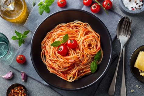 Premium Photo Pasta Spaghetti With Tomato Sauce In Black Bowl Top View
