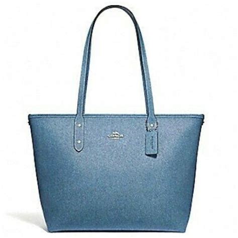 Enjoy The Classic Style Of This City Zip Tote By Coach In A Beautiful