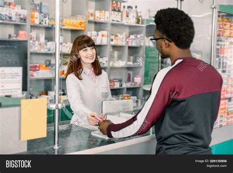 Young Woman Pharmacist Image And Photo Free Trial Bigstock