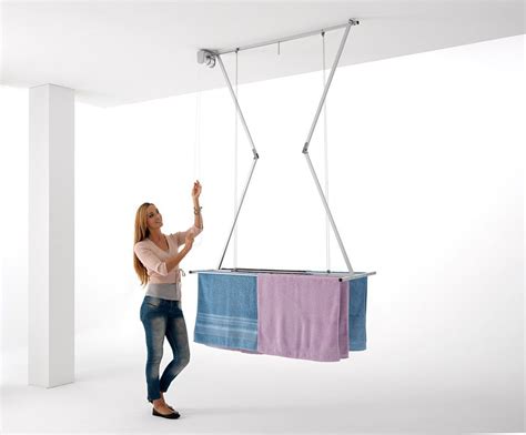 Lower it for loading, then hoist it up to dry washing where the warmth is and out of the way. Ceiling Mounted Pulley Clothes Airer, Clothes drying rack ...