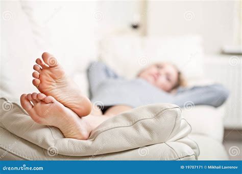 Young Woman Lying On Sofa Focus On Her Feet Stock Image Image Of