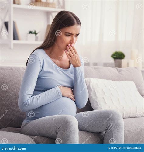 Pregnant Woman Having Pregnancy Morning Sickness Sitting On Couch Stock Image Image Of People