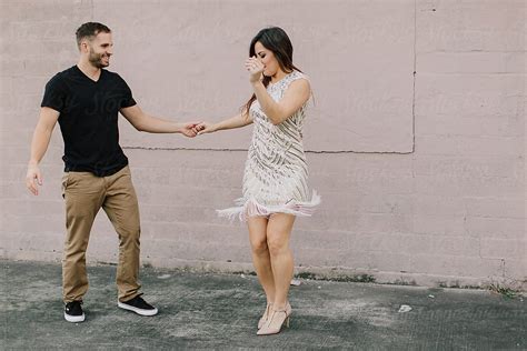 Loving Young Couple Dancing Outdoors By Stocksy Contributor Kristen Curette And Daemaine Hines