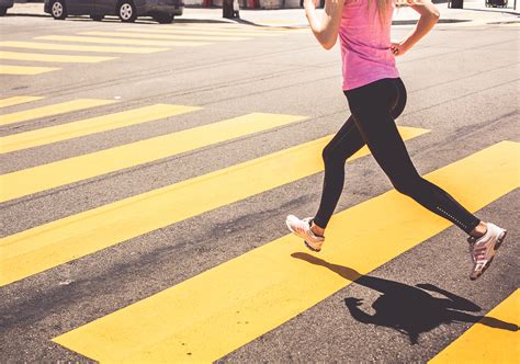 Athletic Woman Running Over The Pedestrian Crossing High Quality Free