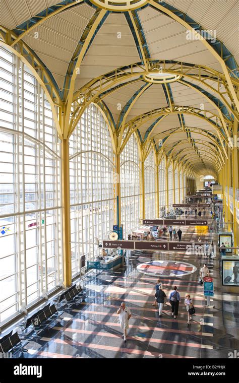 Passengers Walk Through The Airport Terminal At Ronald Reagan