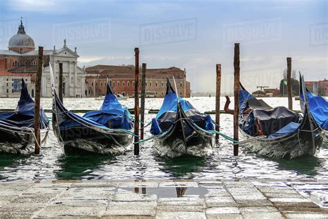 Gondolas And San Giorgio Maggiore Church Venice Italy Stock Photo