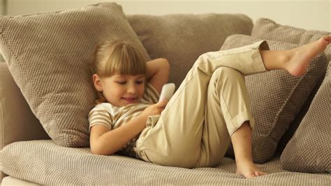 Little Girl Lying On Sofa Stock Footage Video 100 Royalty Free