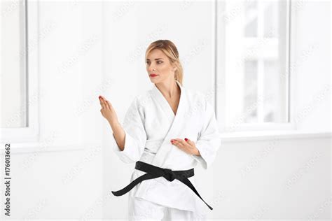 female karate instructor training in dojo stock 写真 adobe stock