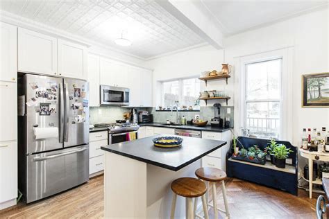 Apartment is a 2 bed, 2.0 bath unit. Tin Ceiling Sets the Tone in a Brooklyn Kitchen | Sweeten.com