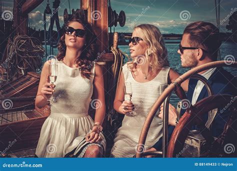Stylish Wealthy Friends Having Fun On A Luxury Yacht Stock Image Image Of Champagne Cruise