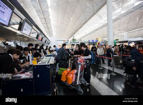 Passengers At Check In Desks Hong Kong International Airport China