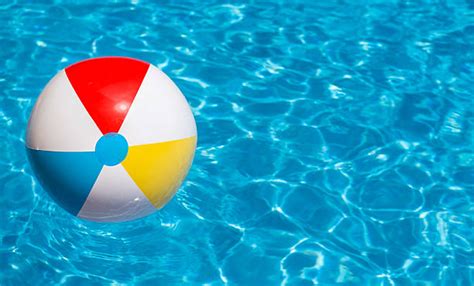 Colorful Beach Ball Floating In A Swimming Pool Pictures Images And