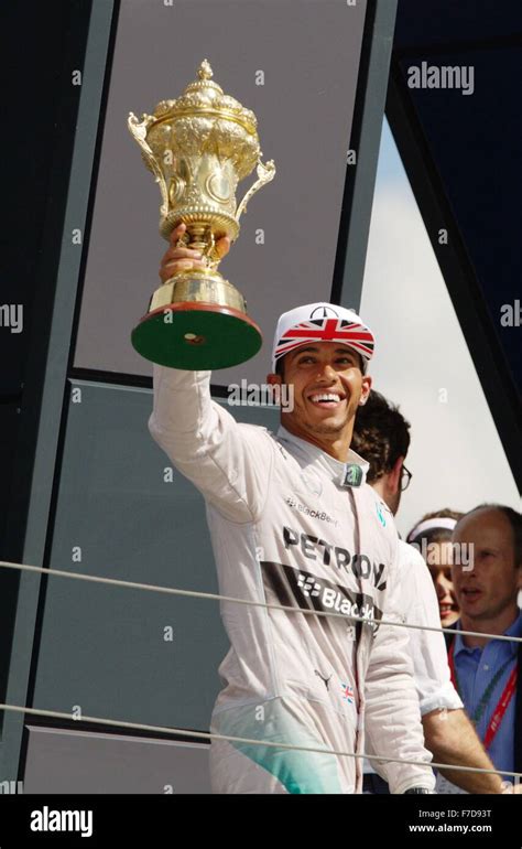 Lewis Hamilton Celebrates Winning The British F Grand Prix At Silverstone By Lifting The