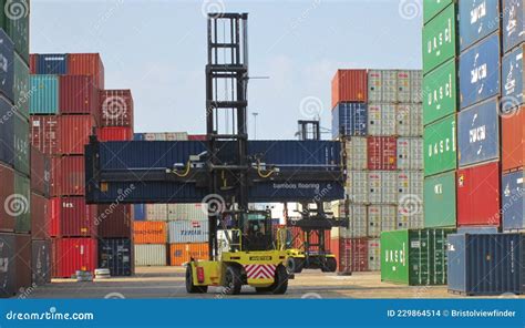 Container Reach Stacker Moving Shipping Containers Around The Storage
