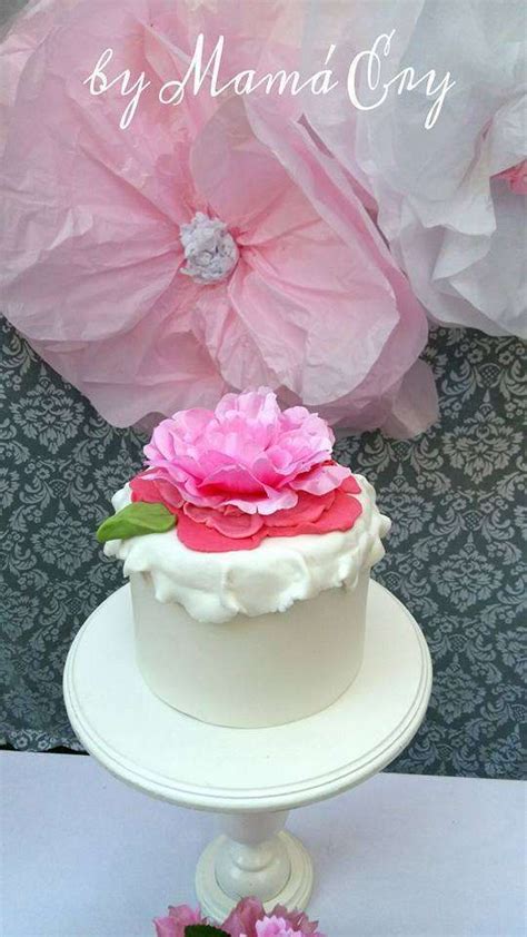 flower topped cake at a shabby chic birthday party see more party ideas at