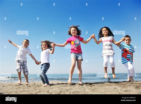 Happy Young People Group Have Fun On Beach Stock Photo Alamy