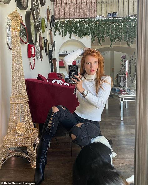 Bella Thorne Strikes A Pose In Turtleneck Top And Ripped Skinny Jeans