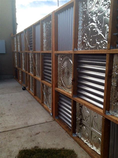 Panels of wood slats mixed with panels of corrugated metal. corrugated metal fences | Backyard fences, Corrugated ...