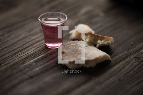 Communion Bread And Wine On A Wood Table — Photo — Lightstock