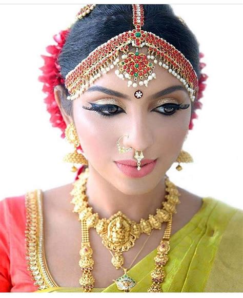 south indian bride gold indian bridal jewelry temple jewelry jhumkis green silk kanchipuram