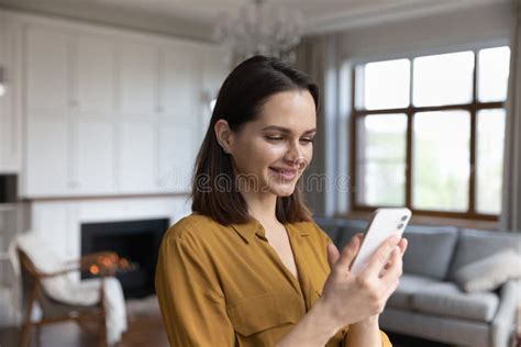 Happy Satisfied Millennial Cellphone User Woman Browsing Internet Stock