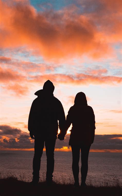 Download 1600x2560 Couple Silhouette Romance Sunset Sky