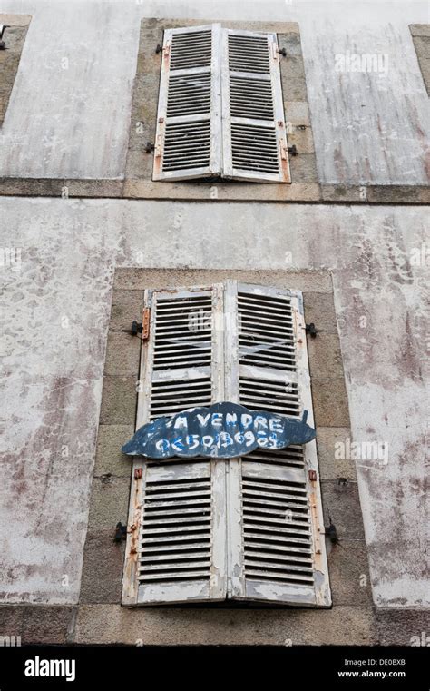 Old French Shuttered Windows On A Building In Douarnenez Brittany