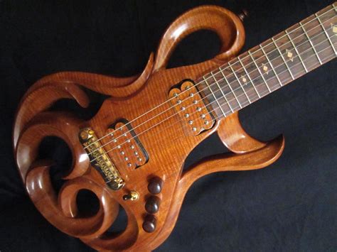 Hand Carved Guitar Of The Beautiful Phoenix Hand Carved Electric Guitar By Rigaud Guitars