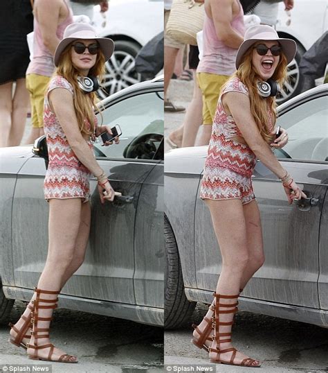 lindsay lohan frolicks at the beach in skimpy outfit and knee high sandals shoes post