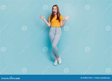 Portrait Of Shocked Speechless Girlish Lady Raise Palms Open Mouth On Blue Background Stock