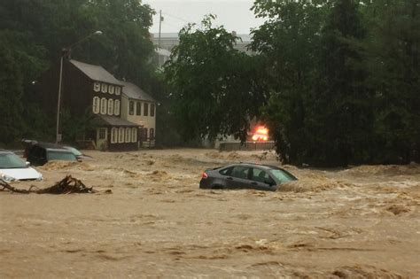 Flash Flood Sweeps Cars Down Street In Maryland