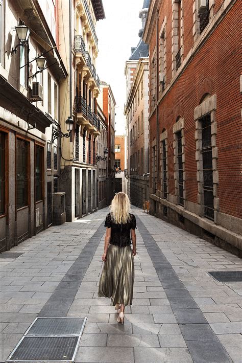 Anonymous Woman Walking On Street Del Colaborador De Stocksy Milles