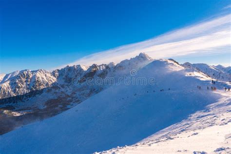 Winter Mountain Landscape Sun Shines Through Mountain Peak At Snowy